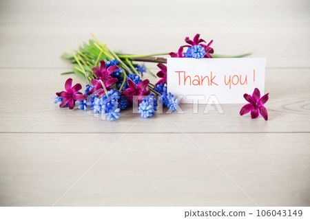 beautiful bouquet of spring flowers on a wooden table 106043149