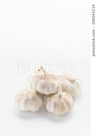 garlic placed on a white background. 106043214