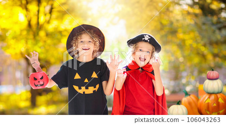 Kids trick or treat. Halloween. Child at door. 106043263