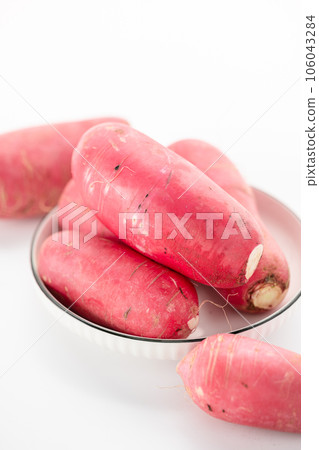 red-skinned radish placed on a white background. red-skinned radish placed on a white background. 106043284