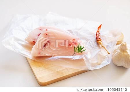 Uncooked swordfish fillet Uncooked swordfish fillet 106043540