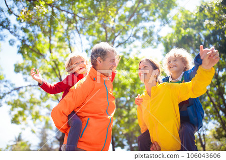 Family walking in autumn park. Fall fun. 106043606
