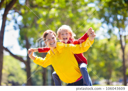 Family walking in autumn park. Fall fun. 106043609