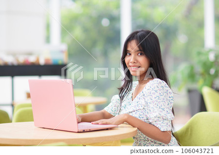 Beautiful young girl with laptop 106043721