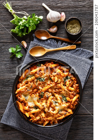 Ground Chicken Pasta Bake in baking dish, top view 106043787