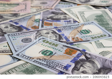 Bundle of dollars on the table close-up - texture, background Bundle of dollars on the table close-up - texture, background 106043823
