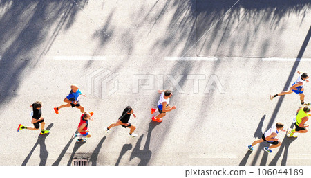 marathon runners competing 106044189