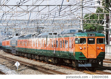 Series 113 train going down the Tokaido Main Line in Yokohama City 106044366