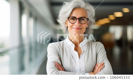 Elegant Mature Executive Projecting Success in Financial District Elegant Mature Executive Projecting Success in Financial District 106045333