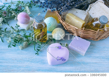Lavender soap, fragrance oil, foam bombs and fresh lavender flowers on a wooden background, bath products Lavender soap, fragrance oil, foam bombs and fresh lavender flowers on a wooden background, bath products 106045800