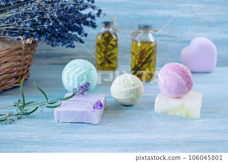 Lavender soap, fragrance oil, foam bombs and fresh lavender flowers on a wooden background, bath products Lavender soap, fragrance oil, foam bombs and fresh lavender flowers on a wooden background, bath products 106045801