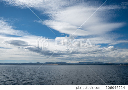 Summer cloudscape over Victoria, British Columbia and Juan de Fuca Strait. Summer cloudscape over Victoria, British Columbia and Juan de Fuca Strait. 106046214