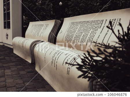 Modern bench in a city park on a sunny day. Bookcrossing zone Modern bench in a city park on a sunny day. Bookcrossing zone 106046876