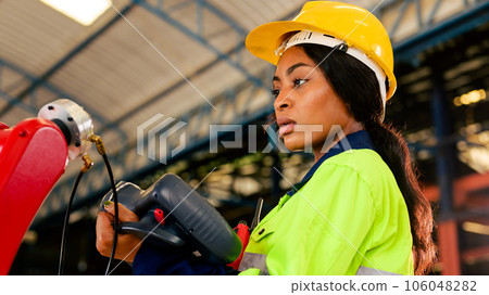 Technician engineer checking and repairing automatic robotic machine Technician engineer checking and repairing automatic robotic machine 106048282