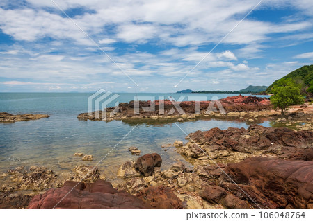 Man fishing on pink rocks at sea in Kung Krabaen, Chanthaburi 106048764