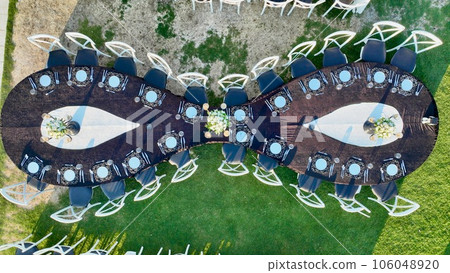aerial view of tables and chairs in country wedding hall aerial view of tables and chairs in country wedding hall 106048920