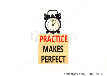 Practice makes perfect symbol. Concept words Practice makes perfect on wooden block. Beautiful white table white background. Black alarm clock. Business practice makes perfect concept. Copy space. 106049169