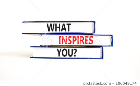 What inspires you symbol. Concept words What inspires you on beautiful book. Beautiful white table white background. Business motivational what inspires you concept. Copy space. 106049174
