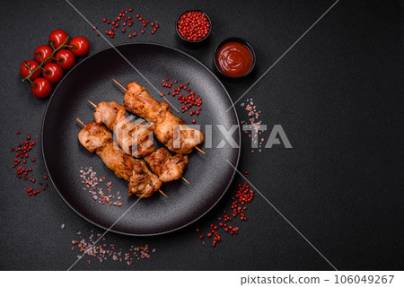 Delicious fresh, juicy chicken or pork kebab on skewers with salt and spices Delicious fresh, juicy chicken or pork kebab on skewers with salt and spices 106049267