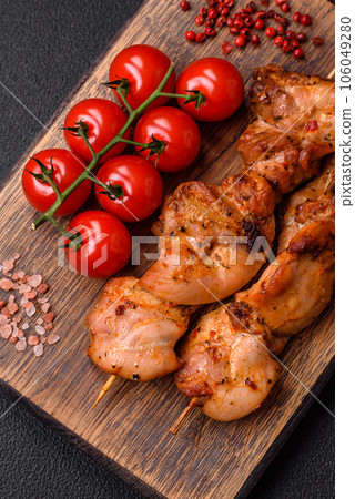 Delicious fresh, juicy chicken or pork kebab on skewers with salt and spices Delicious fresh, juicy chicken or pork kebab on skewers with salt and spices 106049280