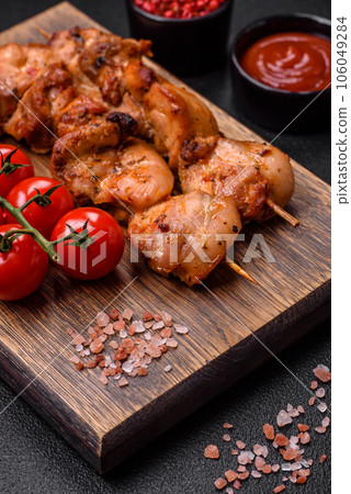 Delicious fresh, juicy chicken or pork kebab on skewers with salt and spices Delicious fresh, juicy chicken or pork kebab on skewers with salt and spices 106049284