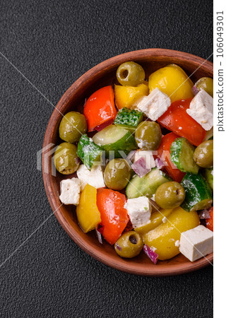 Delicious fresh, juicy Greek salad with feta cheese, olives, tomatoes, cucumber Delicious fresh, juicy Greek salad with feta cheese, olives, tomatoes, cucumber 106049301