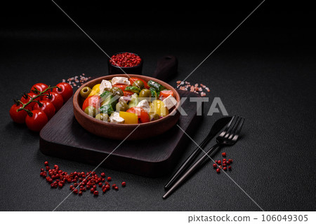 Delicious fresh, juicy Greek salad with feta cheese, olives, tomatoes, cucumber Delicious fresh, juicy Greek salad with feta cheese, olives, tomatoes, cucumber 106049305