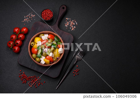Delicious fresh, juicy Greek salad with feta cheese, olives, tomatoes, cucumber Delicious fresh, juicy Greek salad with feta cheese, olives, tomatoes, cucumber 106049306