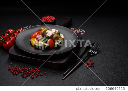 Delicious fresh, juicy Greek salad with feta cheese, olives, tomatoes, cucumber 106049313