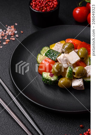 Delicious fresh, juicy Greek salad with feta cheese, olives, tomatoes, cucumber Delicious fresh, juicy Greek salad with feta cheese, olives, tomatoes, cucumber 106049323