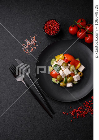 Delicious fresh, juicy Greek salad with feta cheese, olives, tomatoes, cucumber 106049328