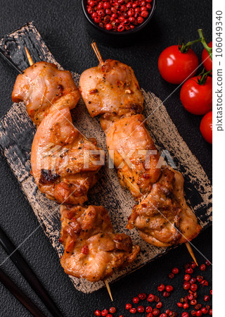 Delicious fresh, juicy chicken or pork kebab on skewers with salt and spices Delicious fresh, juicy chicken or pork kebab on skewers with salt and spices 106049340