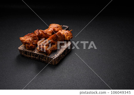 Delicious fresh, juicy chicken or pork kebab on skewers with salt and spices Delicious fresh, juicy chicken or pork kebab on skewers with salt and spices 106049345