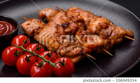 Delicious fresh, juicy chicken or pork kebab on skewers with salt and spices Delicious fresh, juicy chicken or pork kebab on skewers with salt and spices 106049354