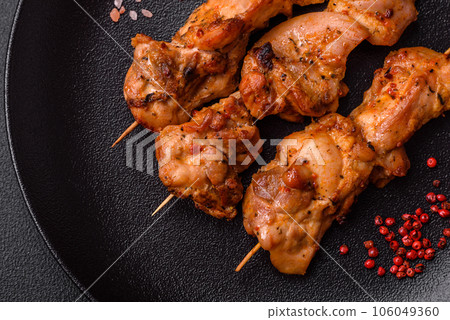 Delicious fresh, juicy chicken or pork kebab on skewers with salt and spices Delicious fresh, juicy chicken or pork kebab on skewers with salt and spices 106049360