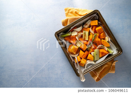 Pumpkin soup. Butternut squash and vegetables ready to be baked in baking tray. Pumpkin soup. Butternut squash and vegetables ready to be baked in baking tray. 106049611