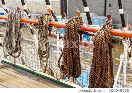Nautical ropes on a deck of a large ship Nautical ropes on a deck of a large ship 106049986