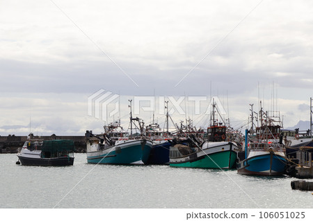 Fishing Trawler Boats Tied Up In Small Harbor Fishing Trawler Boats Tied Up In Small Harbor 106051025