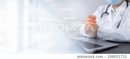 Consulting with the patient showing results on a laptop from Home, Doctor advise painful wrists caused by long hours working on a laptop computer, Carpal tunnel syndrome, rheumatism, hand numbness 106051752