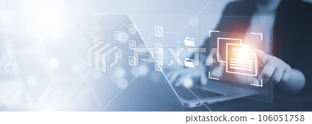 Businesswoman working on laptop with virtual screen. Online documentation database, IT consultant being set up Virtual Document Management System with a laptop, Software for archiving corporate files. 106051758