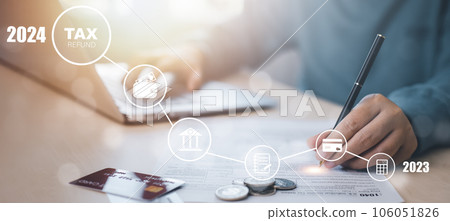 US IRS 1040 form or  US Individual income tax Concept,accountant holding pen working on calculator business with data accounting documents and a laptop, pay tax in 2023 years,new year 2023 tax concept 106051826