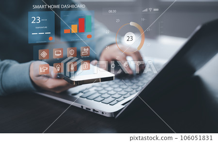 Hand using AI smart tablet with smart home app on the room, circular interface of the smart home automation assistant on the virtual screen and user touches the button, smart home digital interface Hand using AI smart tablet with smart home app on the room, circular interface of the smart home automation assistant on the virtual screen and user touches the button, smart home digital interface 106051831