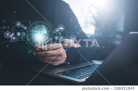 Businessman holding glowing light bulb with AI Data Management System on the computer, Hands working on a laptop cloud network graphic overlay, connected to the database. Corporate strategy finance Businessman holding glowing light bulb with AI Data Management System on the computer, Hands working on a laptop cloud network graphic overlay, connected to the database. Corporate strategy finance 106051843