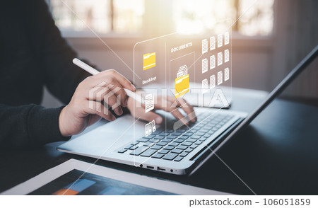 Online documentation database and document management system concept, Businessman using a tablet or computer, Document Management System and Automation software to archiving and efficiently manage. 106051859