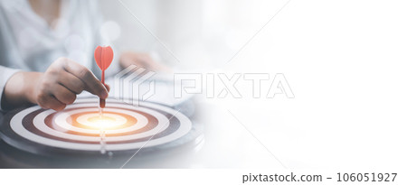 New Targeting with marketing business concept, Businessman hand holding red dart to the virtual target dartboard, Executive marketing, investment goal and target for business investment concept, 106051927