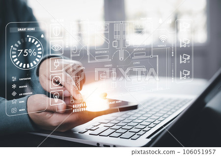 Hand using AI smart tablet with smart home app on the room, circular interface of the smart home automation assistant on the virtual screen and user touches the button, smart home digital interface 106051957