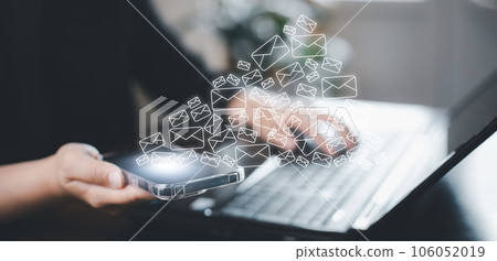 Business people holding smartphone with communication icons, letter icon, email icons, and newsletter email and protect your personal information or spam mail, Customer service call center contact. 106052019