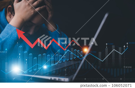 Businesswoman using a laptop and red arrow losses on the stock market chart concept, line market chart and Red arrows fall to the ground, indicating the economic recession that will occur in 2022-2023 Businesswoman using a laptop and red arrow losses on the stock market chart concept, line market chart and Red arrows fall to the ground, indicating the economic recession that will occur in 2022-2023 106052071