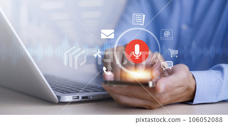 Businessman using smartphone touch microphone button on virtual screen. Blog blog speak talk advertising presentation,Voice recognition, speech detection and deep learning application,Voice Assistance Businessman using smartphone touch microphone button on virtual screen. Blog blog speak talk advertising presentation,Voice recognition, speech detection and deep learning application,Voice Assistance 106052088