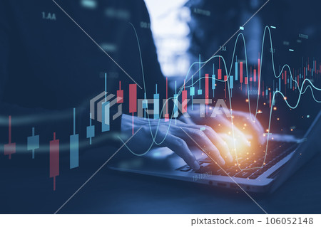 Hand using laptop with planning and strategy, Stock market, Business growth down, Concept of financial crisis, echnical price graph and indicator, red candlestick chart with analyzing forex trading. 106052148
